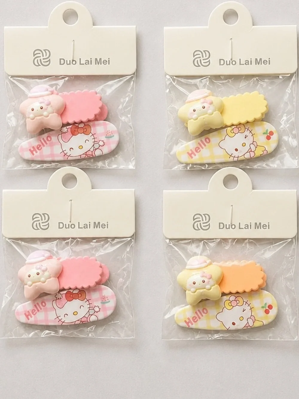 NWT Set of 4 Hello Kitty Child Size Hair Clips Barretts Orange Pink & Purple